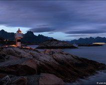 Kabelvåg Lighthouse Ferry Passing By The Kabelvåg lighthouse at dawn, a ferry is passing by.