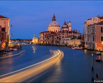 Canale Grande Basilica Santa Maria della Salute A night view to the Canale Grande in Venice and the Basilica Santa Maria della Salute. Longg exposure, light streams of shiphs are floating by.