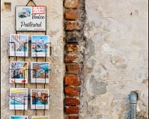 Venice Postcard Classic postcards to sale in Venice and on a typical facade.